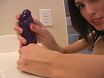 Teasing brunette teen strokes her purple dildo